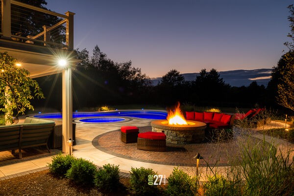 evening backyard pool and fire