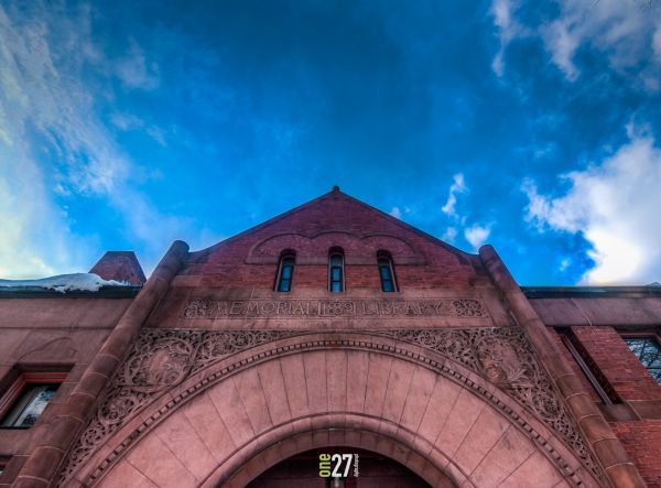 The front arch at the Acton Memorial Library 