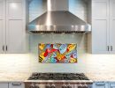 original artwork transferred to a metal surface and mounted as rangetop backsplash