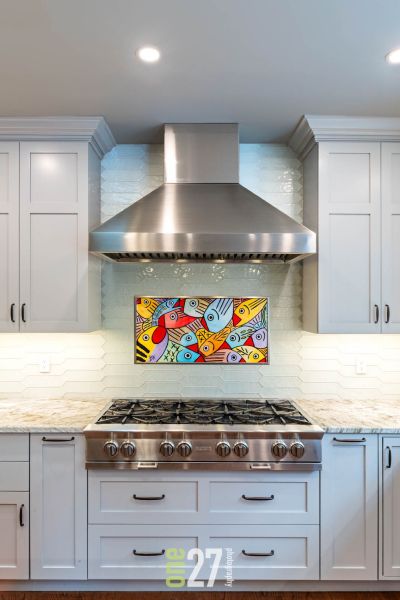 original artwork transferred to a metal surface and mounted as rangetop backsplash