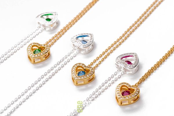 silver and gold birthstone necklace marketing photo